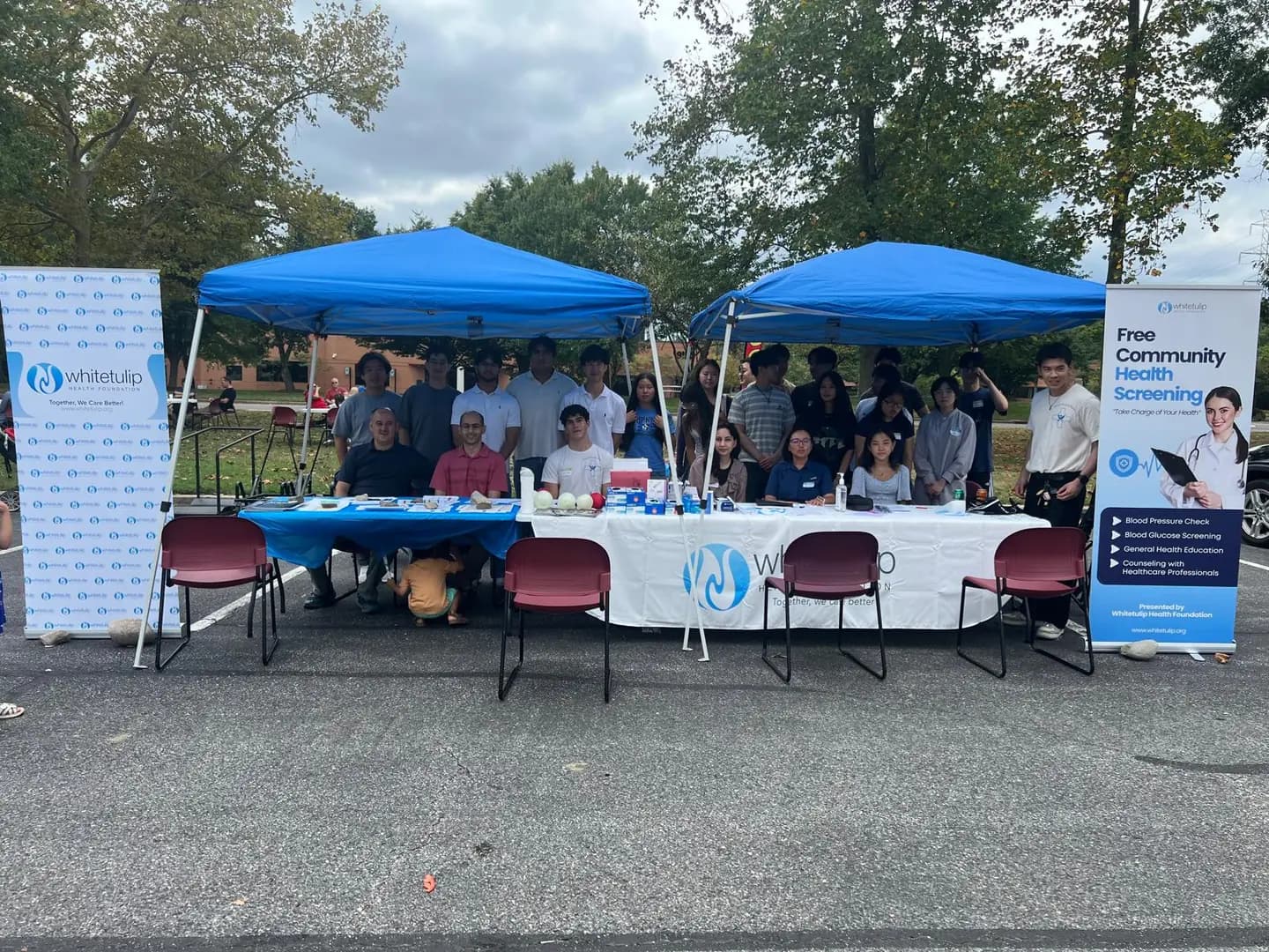 Whitetulip volunteers and healthcare professionals at the community screening