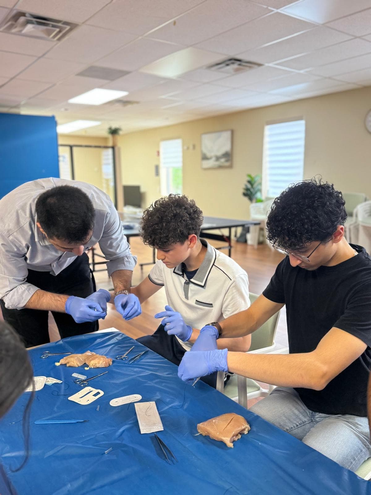 High school students learning suturing